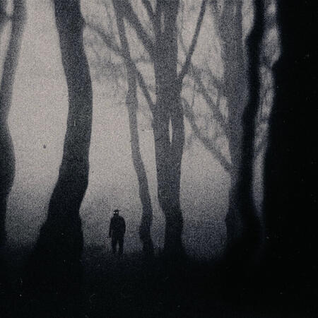 creepy photograph of a sillouette walking in a forest art made by unworns on twitter